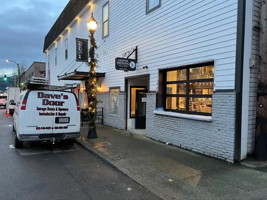 The Dave's Door van parked in downtown Enumclaw in the evening